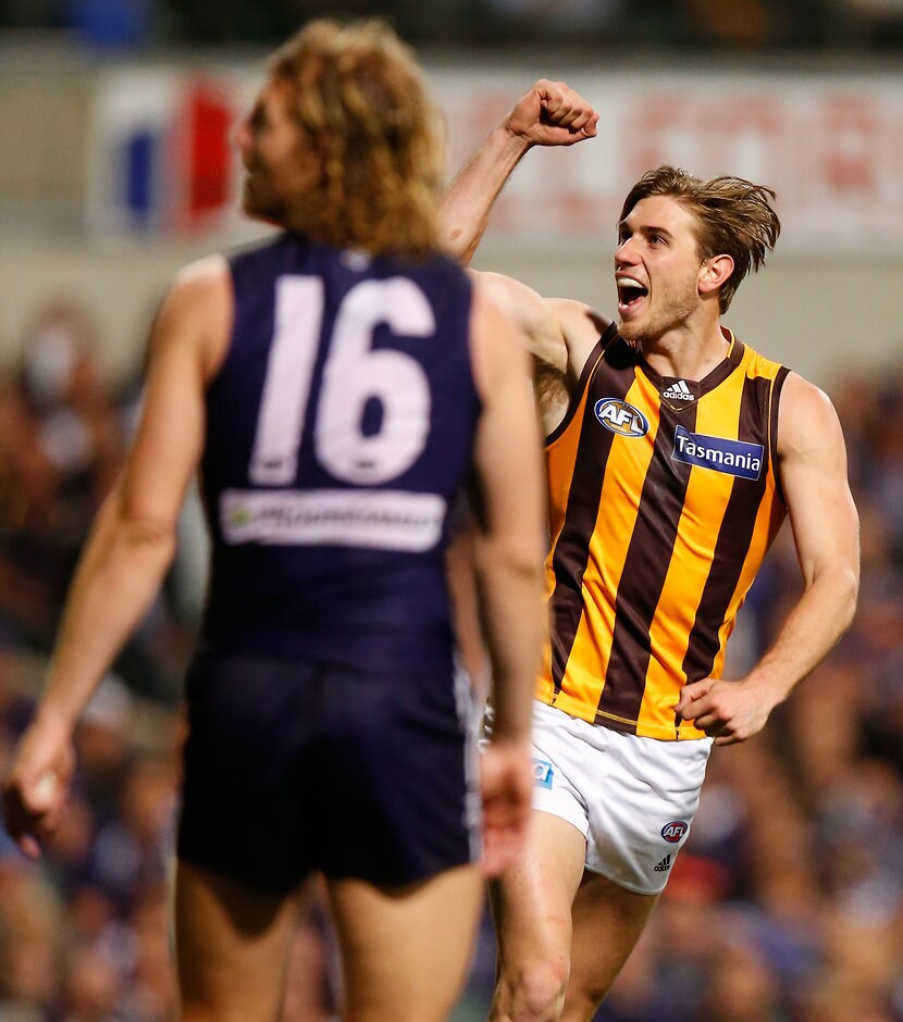AFL 2015 First Preliminary Final - Fremantle v Hawthorn PERTH, AUSTRALIA - SEPTEMBER 25: Ryan Schoenmakers of the Hawks celebrates a goal as David Mundy of the Dockers looks on during the 2015 AFL First Preliminary Final match between the Fremantle Dockers and the Hawthorn Hawks at Domain Stadium, Perth, Australia on September 25, 2015. (Photo by Michael Willson/AFL Media)